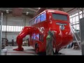 london double decker bus does push ups in preparation for olympics