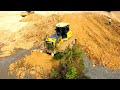 Incredible powerful Extreme bulldozer SHANTUI DH17C2 pushing soil and Dump truck unloading soil