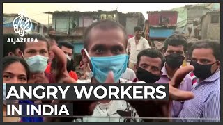 India's migrant workers protest lockdown extension to curb virus