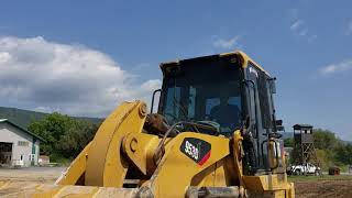 953 track loader pushing fill