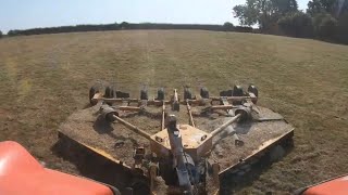 Topping thistles in the Kubota M6132