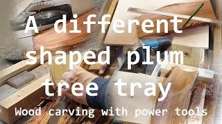 Wood carving with power tools creating a organic shaped plum wood bowl