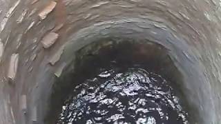 Example of unprotected drinking water in an old open well, India