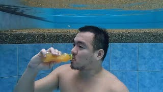 drinking oishi orange underwater