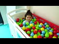 Öykü are playing with colorful balls hide and seek fun kids