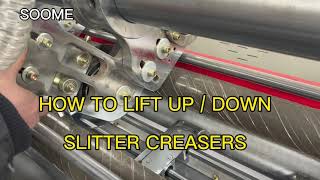 How to lift up lift down blades and creasers on slitter scorer machine ?