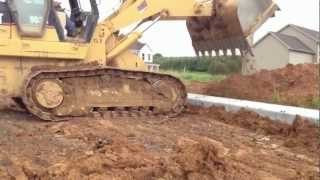 Cat 963 cutting street to sub grade