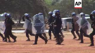 Zimbabwe police beat protesters at legal march