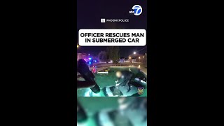 Officer rescues man in submerged car