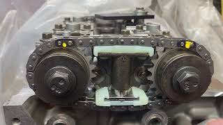 Secondary timing chain clearance with shims. .0015. 0.04m