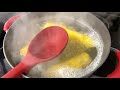 using a spoon to stop water from boiling over