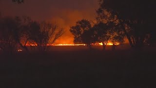 Crews working to contain massive brush fire on Southside