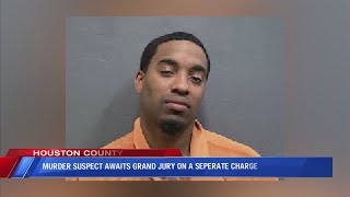 Murder suspect who was out on bond will await a grand jury decision on a seperate charge
