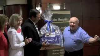 Naperville and Elmhurst Mayors Exchange Gifts as Part of Hospital Merger