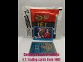 opening a pack of vintage e.t. trading cards from 1982