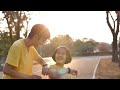 happy asian daughter and father running together in the park slow motion shot