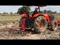 Tractor Kubota M6040 SU Plow Field Mud