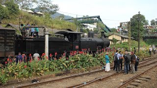 Steam locomotive B2B #213 of Sri Lanka Railways receives fresh water in the tender in Hatton