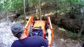 digging a small fish pond with the Kubota tractor