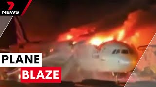 Plane goes up in flames in South Korea | 7NEWS