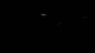 2 Chinook Helicopters flying over the beach at night Okaloosa Island