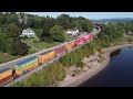 awesome 4k aerial view long stack train nbsr 120 passing thru grand bay westfield nb