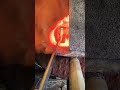 Forge welding and drawing out an 80 layer stack of Damascus steel.  #shorts #forgewelding