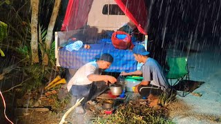 camping in heavy rain, forced to set up a bed on the side of the road due to flooding