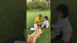 Ziva and Dhoni playing with their pet dog