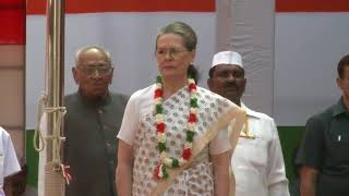 Congress President Smt. Sonia Gandhi hoists the flag at AICC