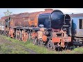 old abandoned rusty trains in uk. abandoned train cars on the barry scrapyard. ghost train