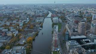 Spree River in Berlin, Germany slow tilt up revealing Cityscape Skyline and TV Tower on
