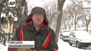 Wisc. residents clear snow ahead of brutal cold