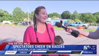 Cycling spectators cheer on racers