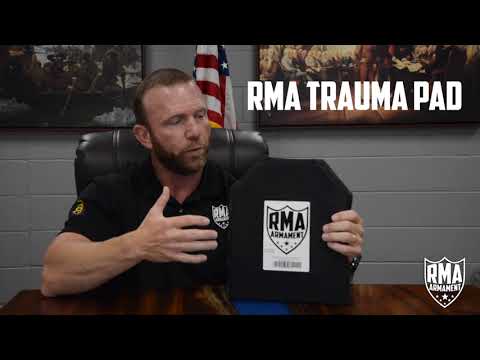 Do trauma pads go in front or behind plates?