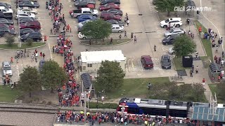 Sky 2 flies over massive lines at METRORail station at NRG