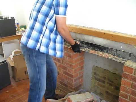 Smashing the fireplace bricks Smashing the fireplace bricks