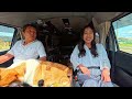 a japanese couple travels overnight in a camper with their dog.