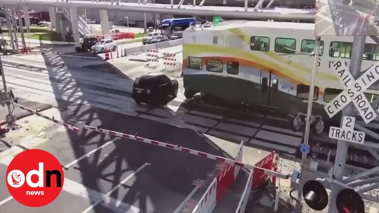 Shocking CCTV Footage Shows Train Crash Into SUV - YouTube