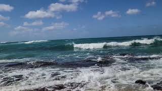 waves over lava rock