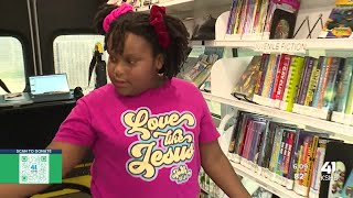 Students talk about their love for reading during Kansas City Public Library mobile book giveaway