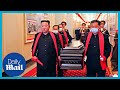 Kim Jong Un carries coffin of top North Korean military official