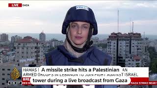 Reporter's live broadcast from Gaza interrupted as missile hits tower
