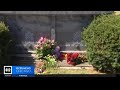 Flowers laid at the grave of Emmett Till 68 year after his brutalized body was found in a river