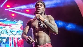 Burna Boy drapes a Nigerian,Ethiopian, Eritrea Flags as he performs \