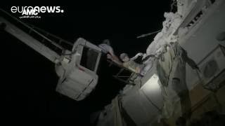 Boy hangs from rubble of building destroyed by airstrike, Aleppo