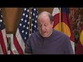 colorado s governor uses a table saw to make his point in news conference