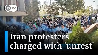 Iran vows tough stance on dissent in public trials | DW News