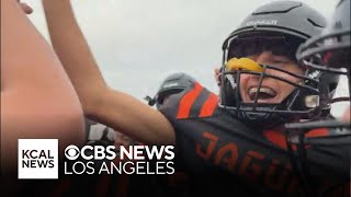 Del Sol High School football team celebrates its first home win