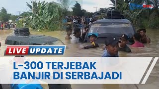 L-300 Bawa Penumpang Terjebak Karena Nekat Terobos Banjir di Serbajadi, Aparat Polisi Bantu Evakuasi